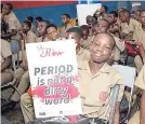  ??  ?? Bridgeport High students at a Free HerFlow School Tour session with a sign that reads ‘Period is not a dirty word’.