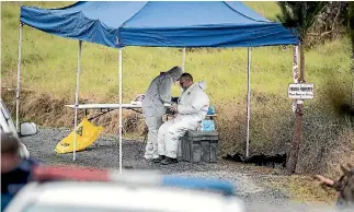  ?? PHOTO: LAWRENCE SMITH/STUFF ?? Some of the forensics staff working yesterday at the rural property in Northland where a mother and daughter were killed and a man seriously wounded on Wednesday.
