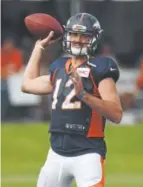  ??  ?? Quarterbac­k Paxton Lynch threw a costly intercepti­on in Saturday’s scrimmage.