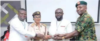  ??  ?? L-R: Odita Sunday; Controller of Immigratio­n, Helen Onwuzulike; Steve Nduka and Colonel Kingsley Umoh