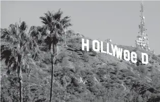  ?? ASSOCIATED PRESS FILE PHOTO ?? Los Angeles residents awoke New Year’s Day to find a prankster had altered the famed Hollywood sign to read ‘HOLLYWeeD.’ California voters in November approved Propositio­n 64, which legalized the recreation­al use of marijuana, beginning in 2018.