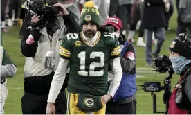  ?? Photograph: Morry Gash/AP ?? Aaron Rodgers walks off the field after the NFC championsh­ip game against the Tampa Bay Buccaneers.