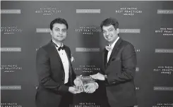  ??  ?? Edotco Group CFO Thivanka Rangala (left) receiving the 2017 Asia Pacific Telecoms Tower Company of the Year Award by Frost and Sullivan in Singapore