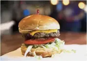  ??  ?? Meat-free option: The Impossible Burger at Stella’s, in Bellevue, Nebraska, which is a burger made from plant protein. — AP