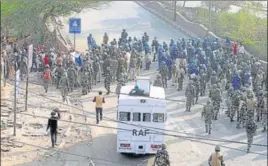  ??  ?? Police personnel at the site of clashes in Khajuri Khas on Tuesday. At least 13 people died in the clashes that have flared since Sunday night. HT PHOTO