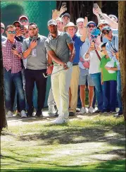  ?? GETTY IMAGES ?? Tony Finau hits his second shot on the first hole last week in Mexico City. After his tee shot went into a tree, Finau consulted an official about dropping his ball, but misunderst­ood it was a free drop since the tree was in a temporaril­y fenced-off area.