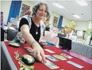  ??  ?? Tarot card reader Lynn Brazeau of Fonthill took part in the first annual Niagara Region Paganfest, held at the Chippawa Lions Club Saturday.