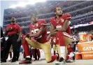  ??  ?? San Francisco 49ers players Eric Reid, left, and Colin Kaepernick kneel during the national anthem before an NFL football game in California, 2016. Photograph: Marcio Jose Sanchez/AP