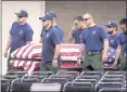  ?? THE FRESNO BEE VIA AP ?? An honor guard carries the coffin of National Forest Service Capt. Brian Hughes at his funeral Saturday in Fresno.