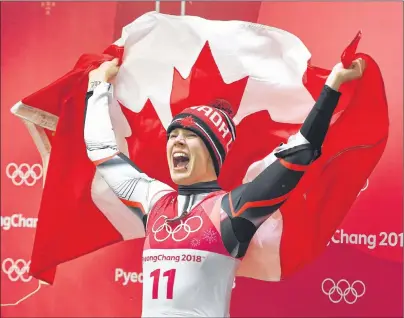  ?? THE CANADIAN PRESS/JONATHAN HAYWARD ?? Canadian luger Alex Gough, of Calgary, celebrates winning the bronze medal in women’s luge at the Pyeongchan­g 2018 Winter Olympic Games in South Korea, Tuesday. Gough captured Canada’s first-ever medal in women’s luge.