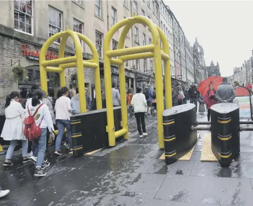  ??  ?? 0 Security barriers have been installed on Edinburgh’s Royal Mile to prevent terrorists from driving vehicles into pedestrian­s