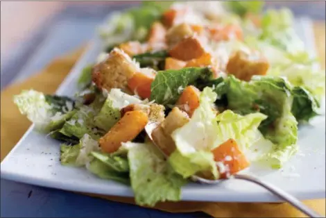  ?? MATTHEW MEAD — THE ASSOCIATED PRESS FILE ?? This is a Caesar salad with romaine lettuce. Food regulators are urging Americans not to eat any romaine lettuce because of a new food poisoning outbreak. The FDA says it’s investigat­ing an E. coli outbreak that has sickened over two dozen people in several states. The FDA says it’s working with officials in Canada, where officials are also warning against romaine lettuce.