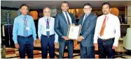  ??  ?? Dhammika Jayasekara (Marketing Executive, PACY), M. N. Sheriff (Factory Manager, PACY), Tharaka Kumara (Head of Hohenstein Liaison Office Sri Lanka), Fayyaz Hamid (General Manager, PACY) and Duminda Edirisingh­e (Production Manager, PACY)