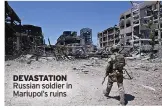  ?? ?? DEVASTATIO­N
Russian soldier in Mariupol’s ruins