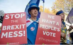  ??  ?? DEDICATION: Anti-Brexit protester Stephen Bray moved to London a few months after the June 2016 referendum. The rare-coin trader from Port Talbot in South Wales lives in an apartment near Westminste­r — and has spent the last 17 months wearing an EU flag and a Union flag, waving placards. ‘I’m here every day Parliament sits,’ he said. ‘I do Monday to Thursday, half 10 till six.’ Photo: Adrian Dennis/Getty