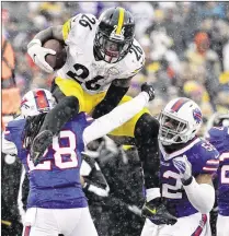  ?? BILL WIPPERT / ASSOCIATED PRESS ?? Steelers running back Le’Veon Bell ran for a club-record 236 yards and had 62 yards receiving in a 27-20 win on the road over the Bills. Bell also scored three touchdowns.