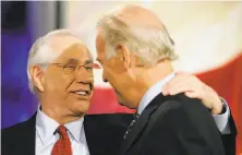  ?? Charlie Neibergall / Associated Press ?? Democratic presidenti­al hopefuls Alaska Sen. Mike Gravel (left) and Sen. Joe Biden talk during a debate break in 2007.