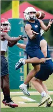  ?? NWA Democrat-Gazette/ANDY SHUPE ?? Bentonvill­e West defender Ariel Bradic (right) intercepts a pass against Fort Smith Northside on June 15 during the Alma 7on7 Showcase football tournament at Citizens Bank Field in Alma.