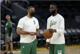  ?? JED JACOBSOHN — THE ASSOCIATED PRESS ?? Celtics guard Jaylen Brown, right, speaks with Coach Ime Udoka during practice June 1 in San Francisco.