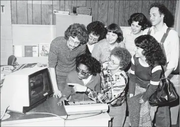  ?? Hearst Connecticu­t Media file photo ?? In 1978, journalism students from the University of Bridgeport try out one of the video display terminals at the Stamford Advocate that “has virtually replaced the typewriter.” Dave Smith, makeup editor, center front, was a teacher at UB.