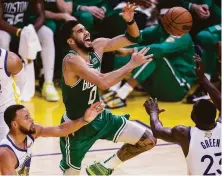  ?? Scott Strazzante / The Chronicle ?? The Warriors turned up their defense in Game 2; here, Tatum loses control of the ball during the third quarter.