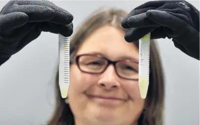  ?? PHOTO: PETER MCINTOSH ?? Chilly work . . . Associate Prof Janice Lord with vials of corpse plant pollen frozen at 80degC at the University of Otago botany department.