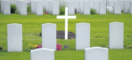  ?? SEAN KILPATRICK/THE CANADIAN PRESS ?? Military grave stones are pictured at a cemetery in Ottawa on Monday. The words on each grave marker are easy to read, even those carved decades ago, while the grey stones are all clean, the surroundin­g grass and flowers are trim and manicured. Such a...