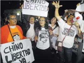  ?? Martin Mejia ?? The Associated Press Supporters of former President Alberto Fujimori celebrate his medical pardon Sunday outside the clinic in Lima, Peru, where the jailed leader was admitted the previous day after suffering a drop in blood pressure.