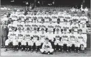  ?? THE ASSOCIATED PRESS FILE ?? The 1948 Indians team picture was taken Oct. 3 in Cleveland. Front row, left to right: Eddie Robinson,; Ken Keltner, Al Rosen, Coach Mel Harder, Manager Lou Boudreau, President Bill Veeck, Coach Muddy Ruel, Coach Bill McKechnie, Joe Gordon and Johnny Beradino; Second row, left to right: Sam Zoldak, Ed Kleiman, Steve Gromek, Russ Christophe­r, Gene Bearden, Bob Lemon, Satchel Paige, Bob Feller, Bob Muncriff and trainer Lefty Weisman. Top row, left to right: Walt Judnich, Allie Clark, Hal Peck, Larry Doby, Hank Edwards, Dale Mitchell, Bob Kennedy, Jim Hegan, Ray Boone, Joe Tipton and Thurman Tucker.