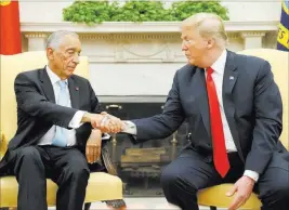  ?? Pablo Martinez Monsivais ?? The Associated Press President Donald Trump and Portuguese President Marcelo Rebelo de Sousa shake hands Wednesday in the Oval Office of the White House.