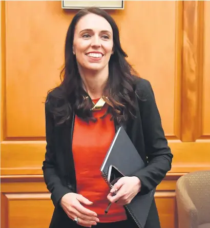  ?? Picture: AFP ?? HERE I AM. New Zealand Labour Party leader Jacinda Ardern receives applause as she is welcomed to her first caucus meeting as prime minister-elect at parliament in Wellington yesterday.