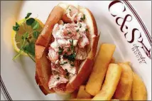  ?? CONTRIBUTE­D BY JEFF MOORE ?? Choose from a Maine-style (chilled with celery and mayo) or Connecticu­t-style (warm with drawn butter) lobster roll at C&amp;S Chowder House.