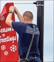  ?? Kevin Myrick /
Standard Journal ?? The holiday banners went up last week ahead of films crews coming to Cedartown to use it as a fictional town for the upcoming season of “Hap and Leonard” on Sundance TV.