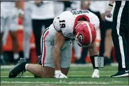  ?? (AP/George Walker IV) ?? Georgia tight end Brock Bowers kneels on the turf Saturday after being injured during a 37-20 win over Vanderbilt in Nashville, Tenn. Georgia won’t play again until Oct. 28, giving Bowers extra time to get healthy.