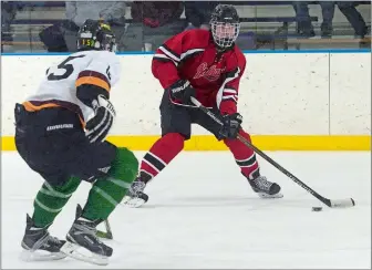  ?? DANA JENSEN/ THE DAY ?? Forward Ryan LoVetere of the Redhawks, right, controls the puck against Riley Jordan of the Eastern Connecticu­t Eagles during a game last season at Connecticu­t College. Both players return for the 2017-18 season, which begins Saturday.