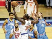  ?? Jon Shapley / Staff photograph­er ?? Knicks forward Julius Randle, who had a game-high 31 points, makes a shot in the first quarter Sunday.