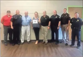  ?? Contribute­d by Street grace ?? From left: Rockmart Fire Chief Todd Queen, Polk County Chief of Police Kenny Dodd, Rockmart City Councilman Rick Stone, Street Grace VP of Policy Camila Zolfaghari, City Manager Jeff L. Ellis, Rockmart Chief of Police Randy Turner, Polk County Sheriff Johnny Moats, and Cedartown Police Chief Jamie Newsome