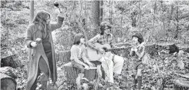  ??  ?? Coryell, center, and, on maracas, his wife, Julie Coryell, play music in their backyard while their sons, Julian and Murali, sing along in 1978 in Westport, Conn. Among his strong recordings is one from 1999 that included his sons.