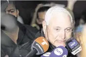  ?? BIENVENIDO VELASCO Sipa USA/EFE ?? The former president of Panama, Ricardo Martinelli, speaks to reporters in November 2021. Martinelli had appeared in polls as the front-runner for Panama’s May 5 presidenti­al election but was disqualifi­ed from running after he received a 10-year sentence for money laundering.