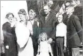  ?? COURTESY OF MERRY WILLIAMS ?? John Fulton (center, with mustache) stands with his family on the Fulton Hill property in the early 1900s in front of his home’s double-trunk pepper tree.