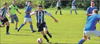  ?? 01_B20footy02 ?? Johnnie Sloss, in full flow, dances through the defenders.