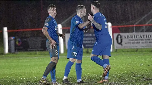  ?? ?? THE EQUALISER: Joe McKee, centre, is congratula­ted by team-mates Ryan Strachan and Andy McCarthy after scoring Peterhead’s leveller.