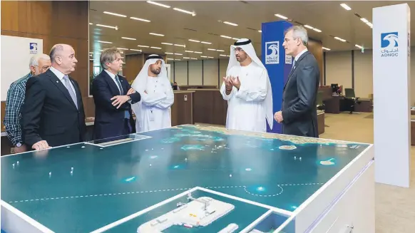  ??  ?? Adnoc Group chief executive Dr Sultan Al Jaber with OMV’s executive board chairman Rainer Seele, right, in Abu Dhabi yesterday Adnoc