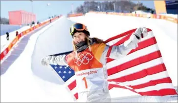  ?? AFP ?? Gold medallist Chloe Kim of the US celebrates during the women’s snowboard halfpipe victory ceremony today at Phoenix Park during the 2018 Pyeongchan­g Winter Olympic Games.