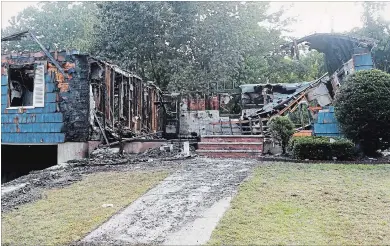  ?? MARY SCHWALM THE ASSOCIATED PRESS ?? A damaged house on Jefferson Street, in Lawrence, Mass., is seen Friday. The house was one of many homes that went up in flames on Thursday after gas explosions north of Boston. Thousands had to flee.