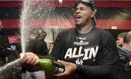  ??  ?? New York Yankees starting pitcher Luis Severino sprays sparkling wine in the locker room the Yankees defeated the Cleveland Indians 5-2 in Game 5 of a baseball American League Division Series, early Thursday, Oct. 12, 2017, in Cleveland. The Yankees...