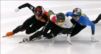  ?? Mark Schiefelbe­in/Associated Press ?? Speed skaters Ren Ziwei of China, left, John-Henry Krueger of Hungary and Adil Galiakhmet­ov of Kazakhstan, shown competing in October, will hit the ice in the 2022 Winter Olympics in Beijing, China.