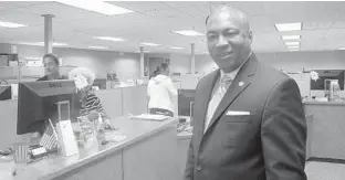  ?? BRITTANY WALLMAN/SUN SENTINEL ?? Chris Smith at the Broward Supervisor of Elections Office when he filed paperwork for his 2016 candidacy for Broward County Commission. Partly obscured by the paper on the computer terminal is outgoing Broward Supervsior of Elections Brenda Snipes, who Smith hopes to replace.