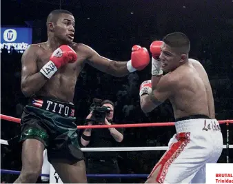  ??  ?? BRUTAL BATTLE: Trinidad defeats Vargas in a Las Vegas classic