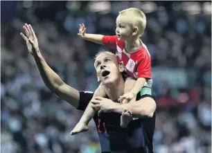  ?? PHOTO: GETTY IMAGES ?? Domagoj Vida celebrates victory with his son.